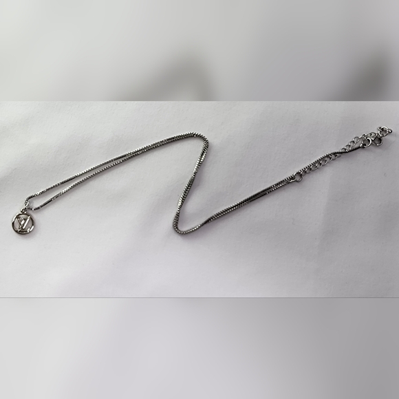 Authentic Louis Vuitton silver petite LV charm on chain - Picture 7 of 8